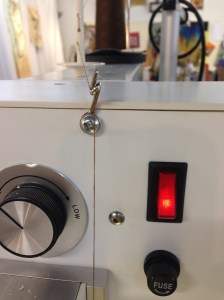 Repositioned thread guide.